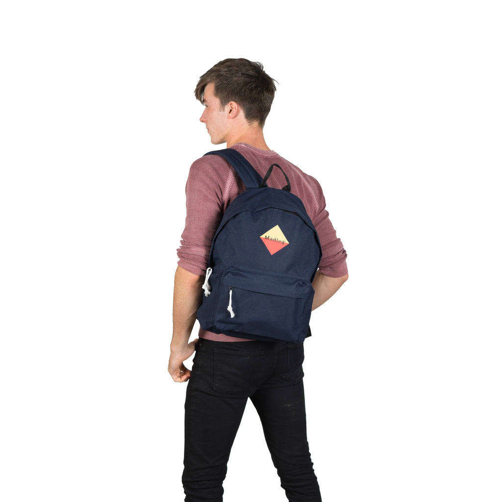 Madlug Classic Backpack in Navy. Male model rear view.