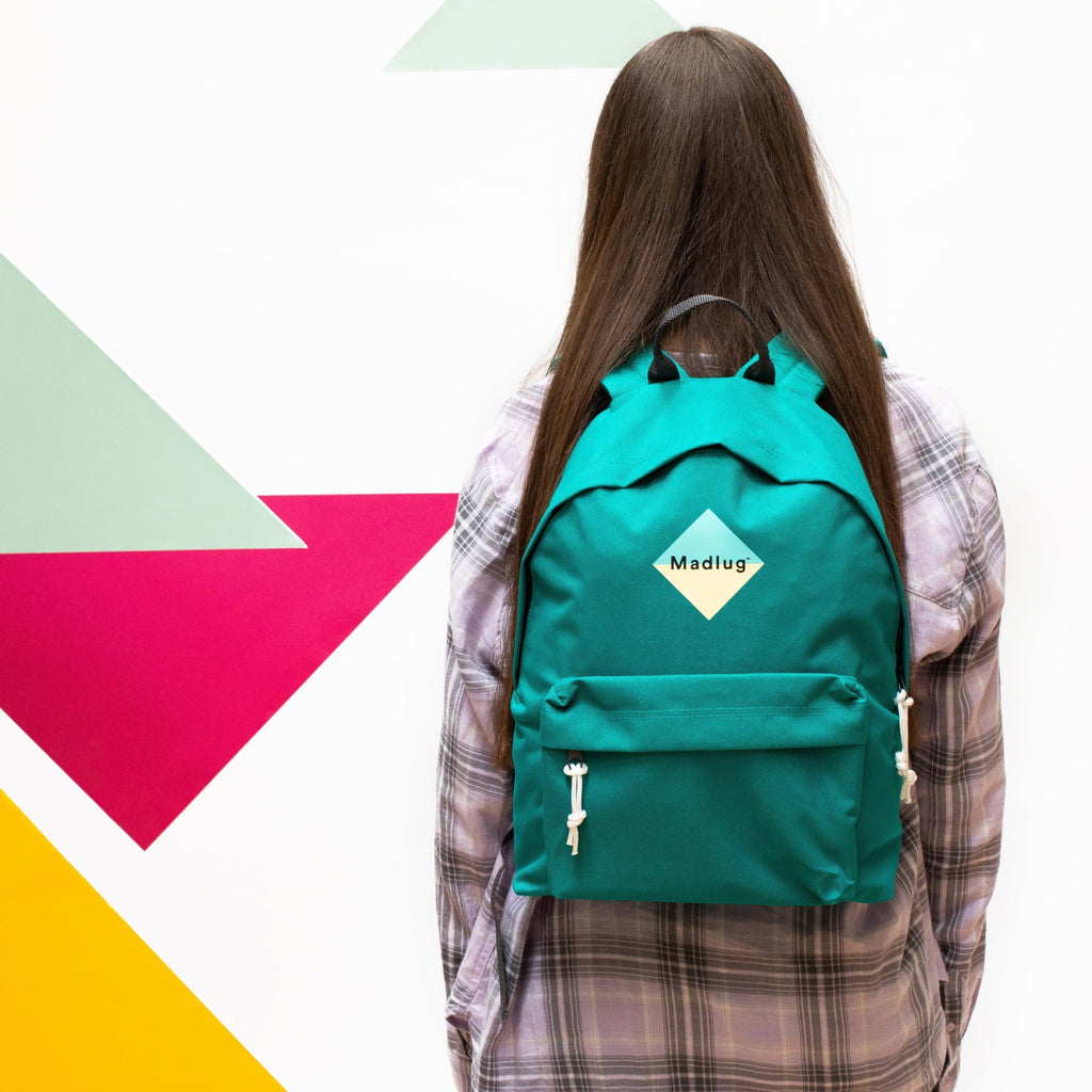 Madlug Classic Backpack in Teal Green. Female model rear view.