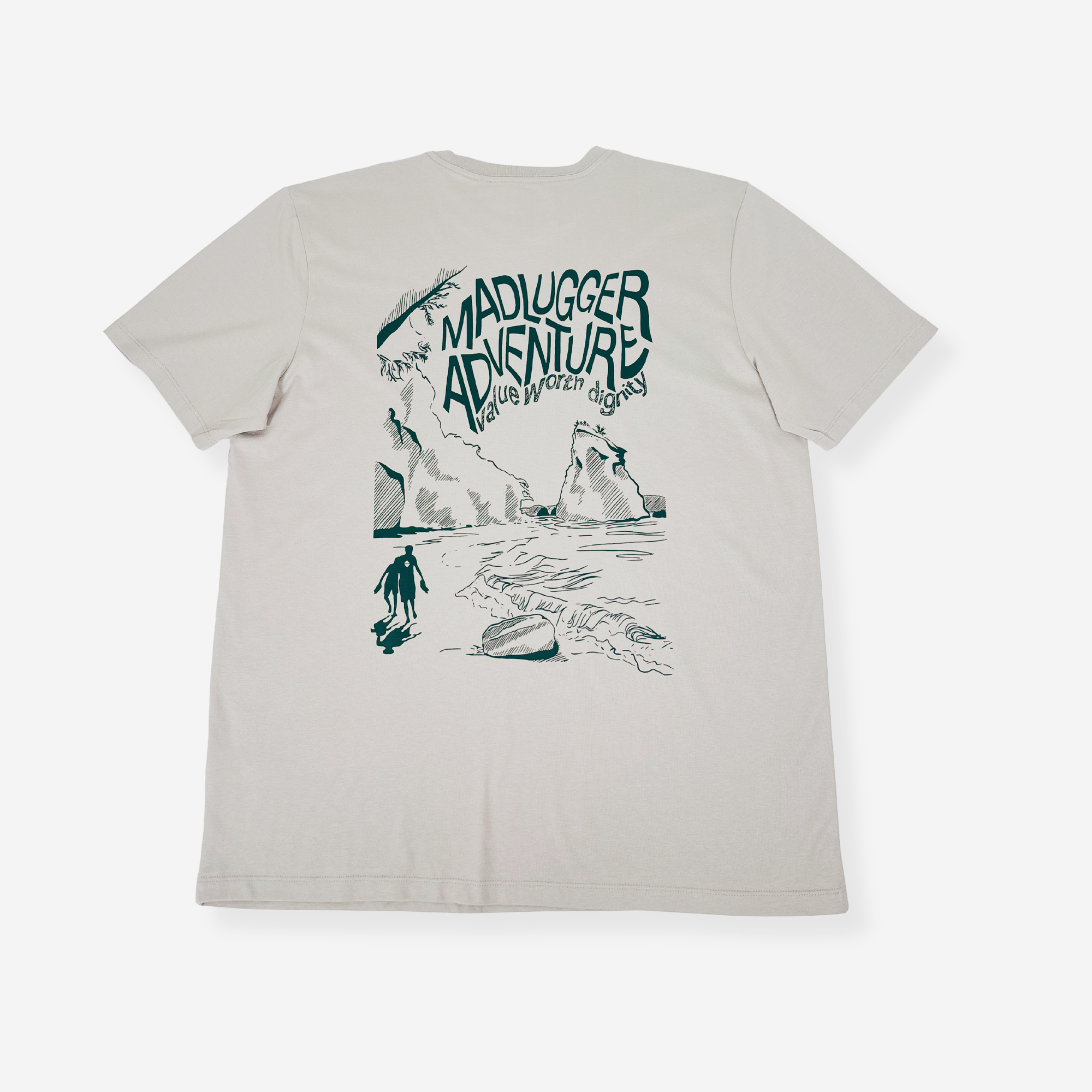 A classic stone short-sleeve t-shirt with a white graphic print on the back. The graphic features the text 'MADLUGGER ADVENTURE' in a stylized font above a hand-drawn illustration of a person surfing on a beach with waves and cliffs.