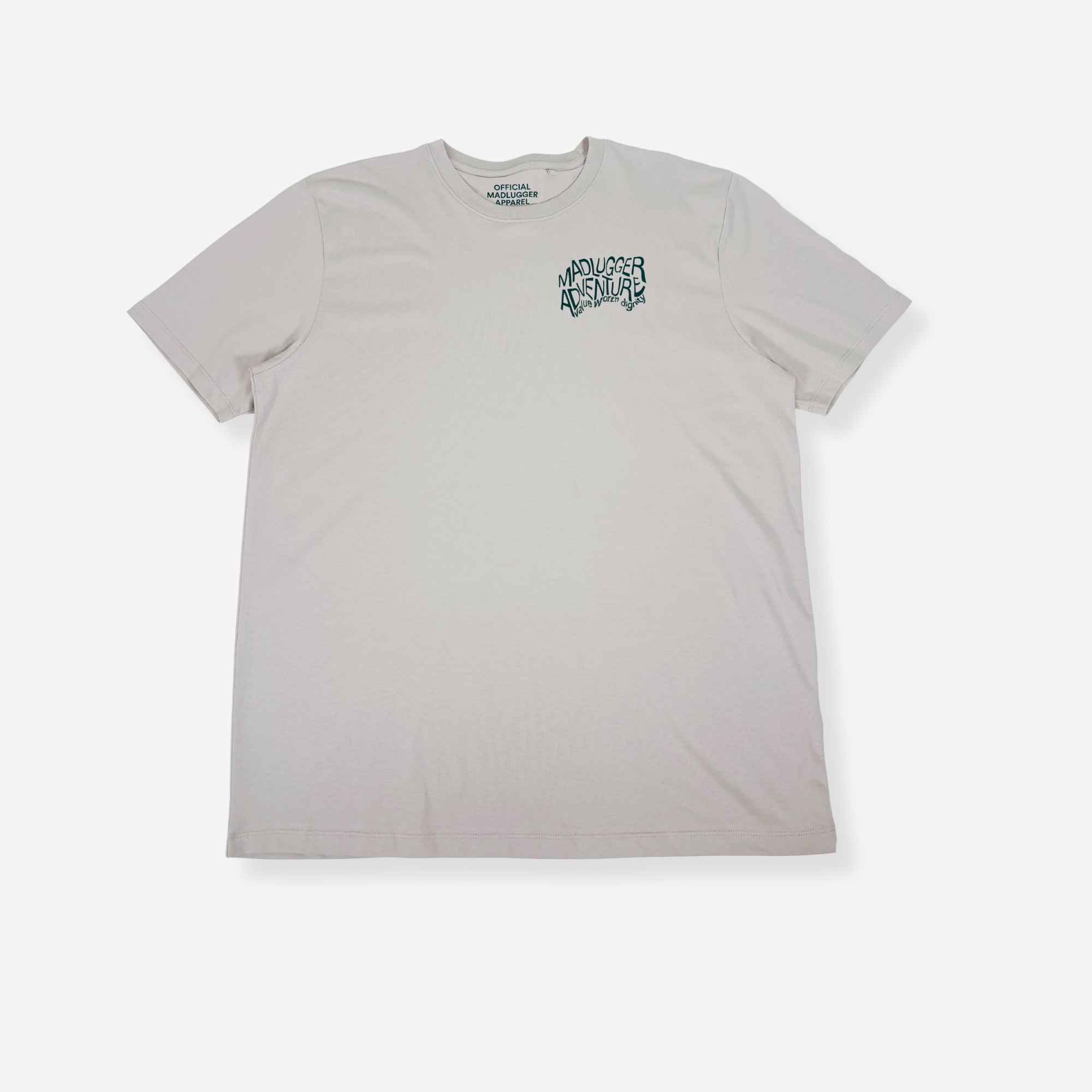 A classic stone short-sleeve t-shirt with a stylised white graphic on the left chest reading 'MADUGGER ADVENTURE', displayed flat against a light gray background.