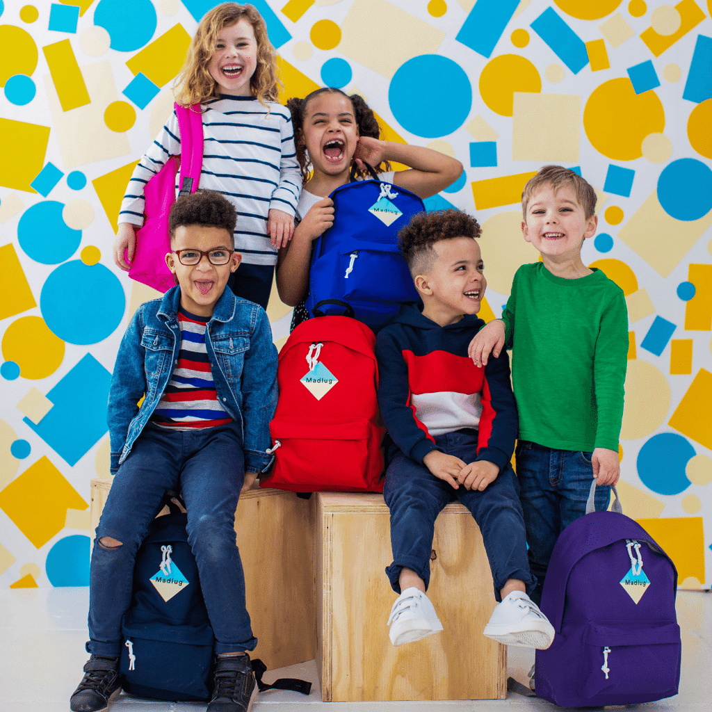 Madlug Junior Backpacks. Studio image with kids wearing backpack.