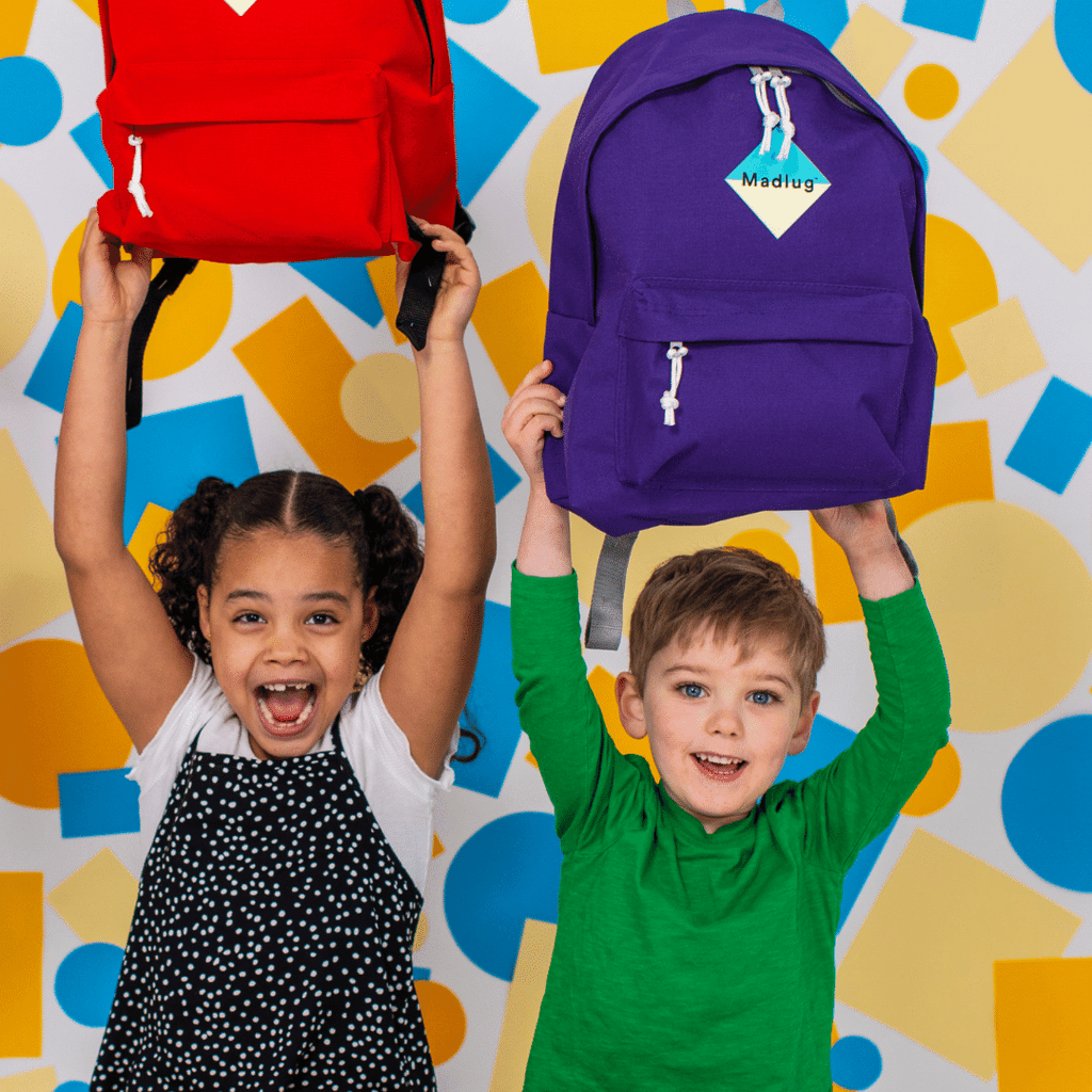 Madlug Junior Backpacks. Studio image with kids wearing pink backpack.
