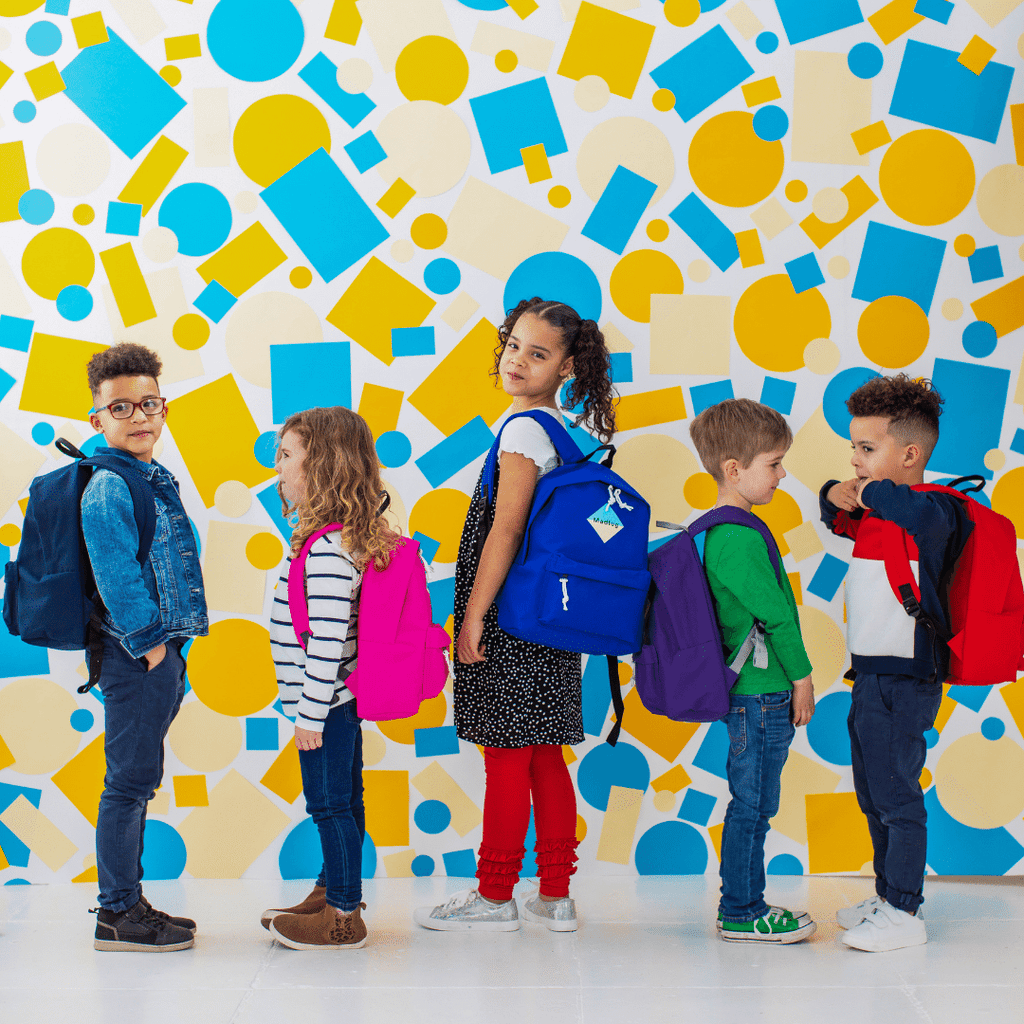Madlug Junior Backpacks. Studio image with kids wearing backpack.